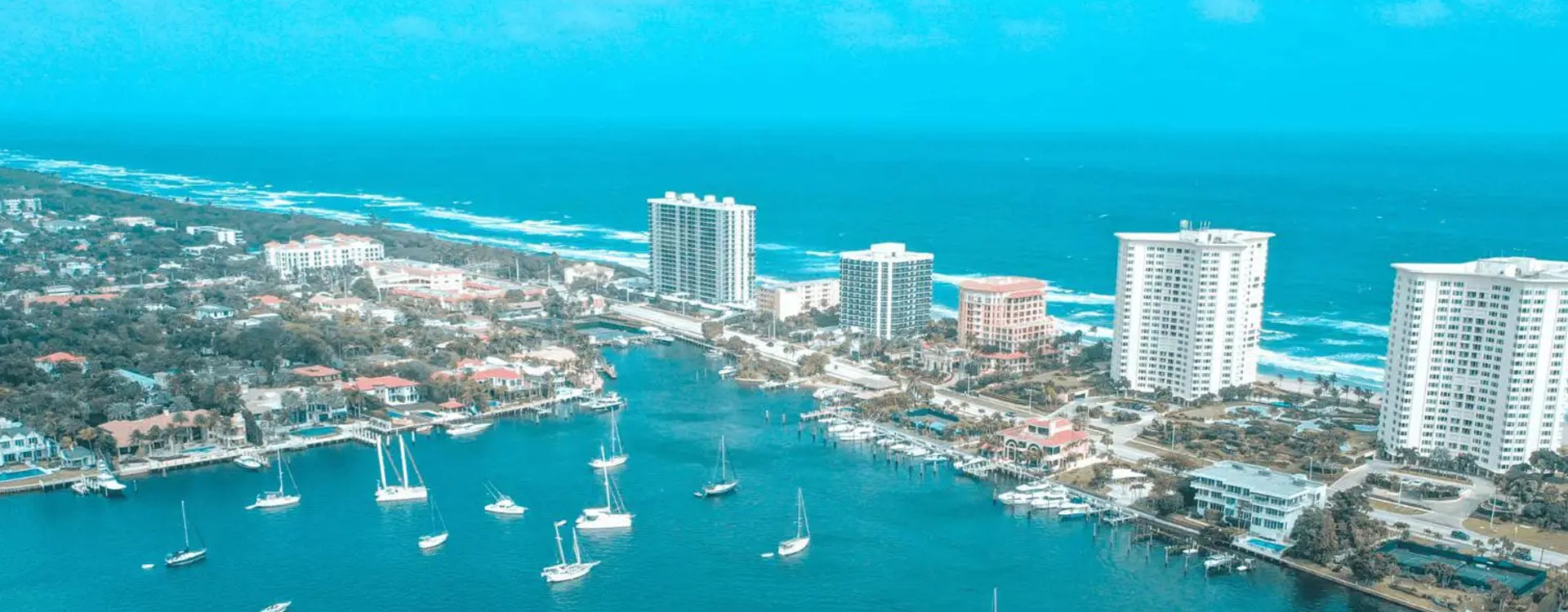 a city with a large body of water. featuring tiki bar experiences and Intracoastal Waterway cruises by Aquaholics Florida