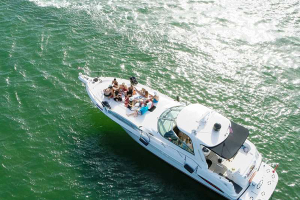 people riding on top of a white boat. featuring Intracoastal Waterway cruises and Fort Lauderdale