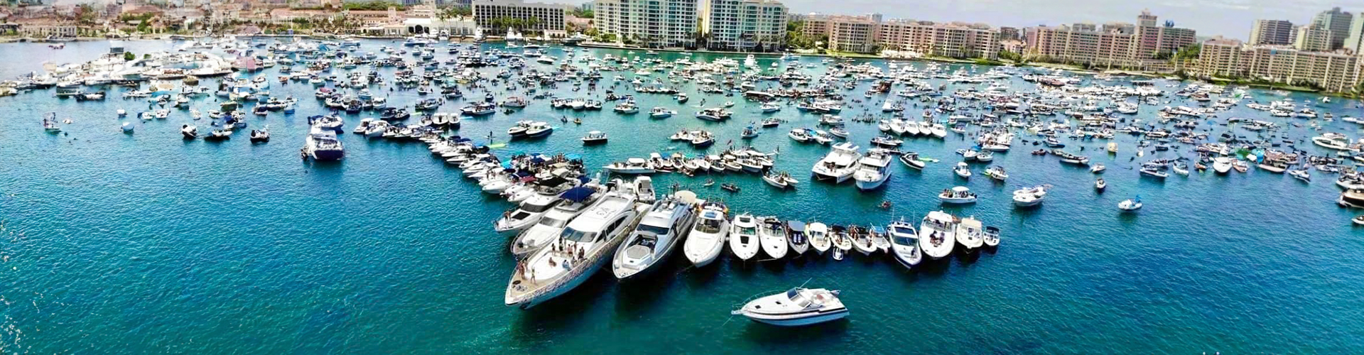 a large body of water with boats docked. featuring tiki bar experiences and yacht charters by Aquaholics Florida