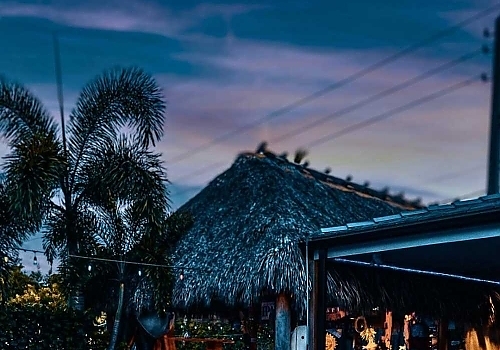 View of building at dusk featuring boat parties and luxury boat events in South Florida by Aquaholics Florida