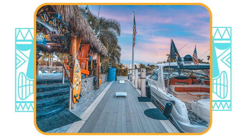 a large boat is docked at a pier. featuring boat parties and South Florida boating by Aquaholics Florida