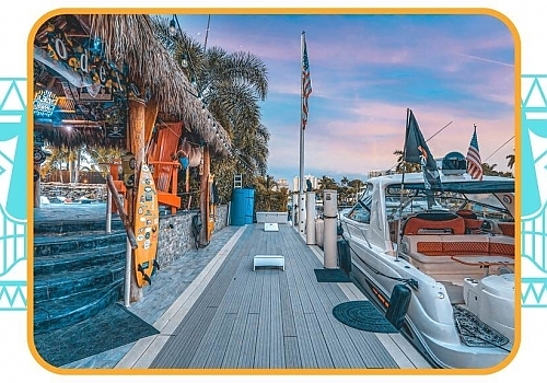 a large boat is docked at a pier. featuring boat parties and South Florida boating by Aquaholics Florida